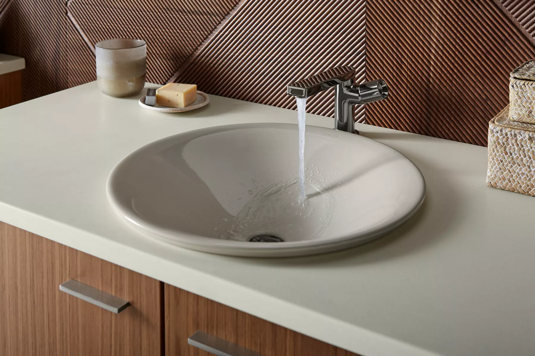 Image of a bathroom faucet turned on