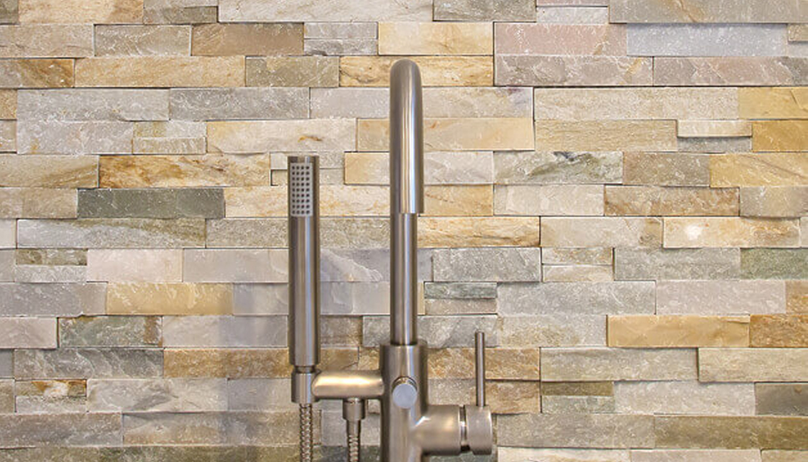 Image of tile behind a bath faucet