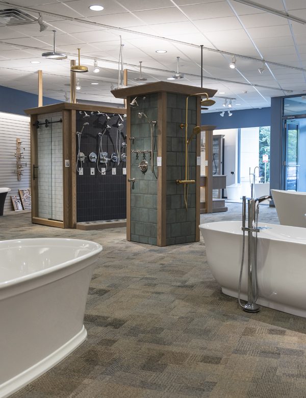 Image of a showroom with stone, tile, and bathroom fixtures