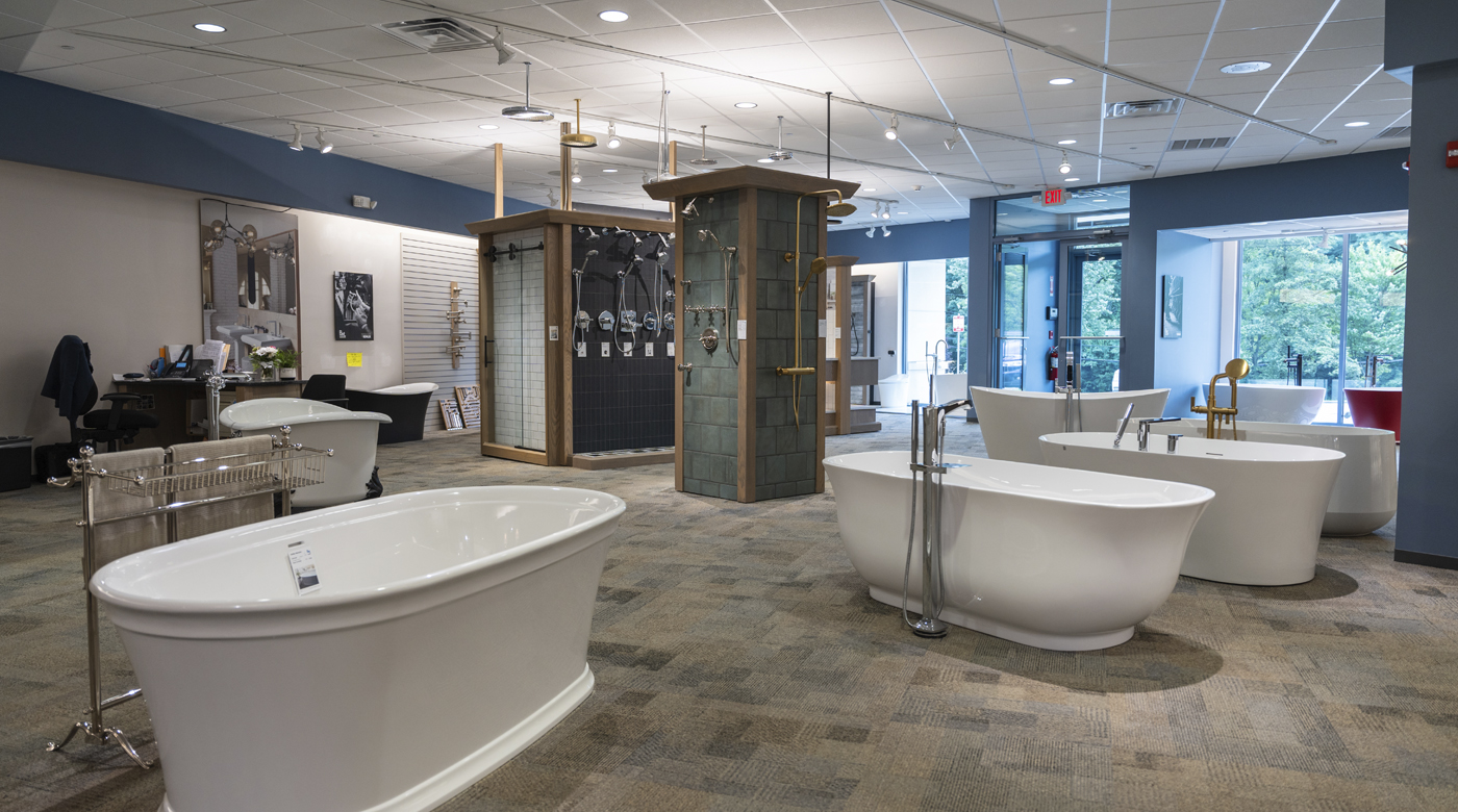 Image of a showroom with stone, tile, and bathroom fixtures